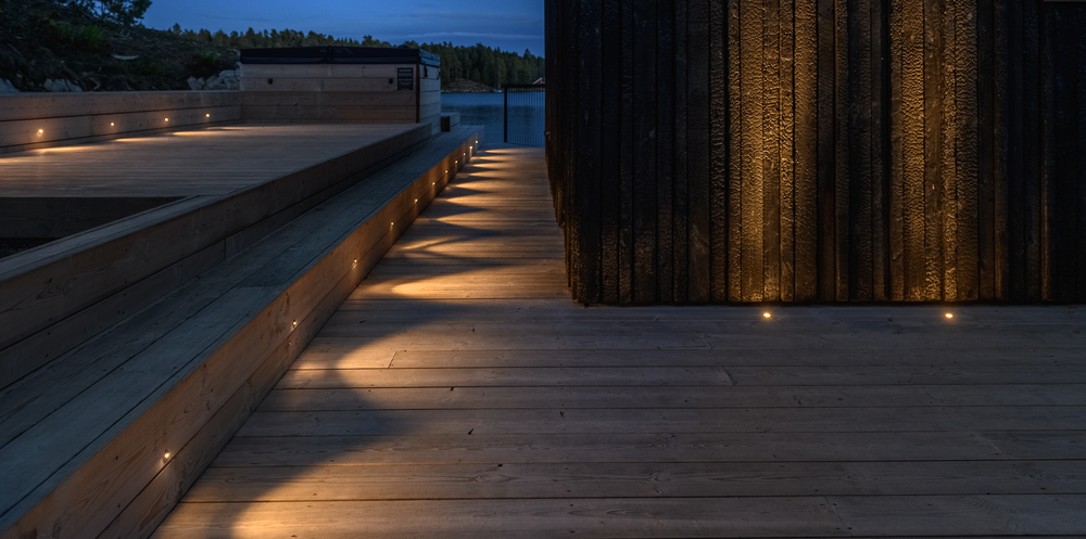 A structure and dock illuminated with lights